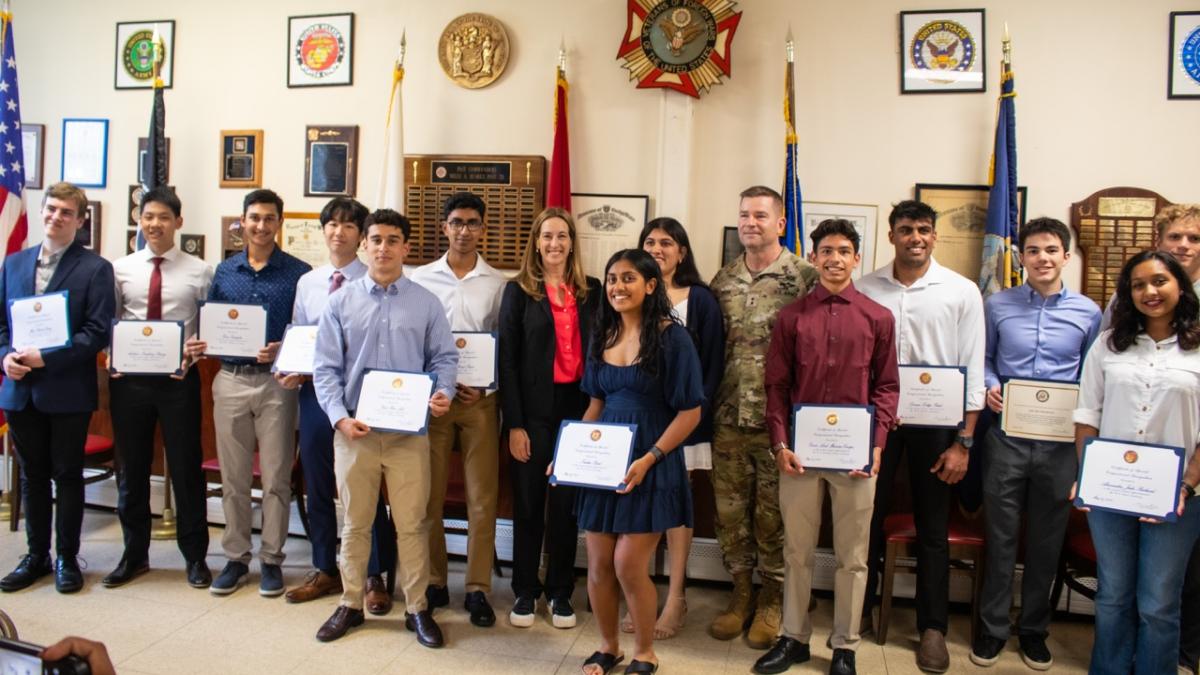 Rep. Sherrill standing alongside the 2025 appointees