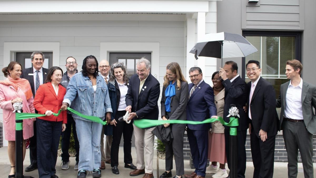 Rep Sherrill cutting the ribbon for The Forum