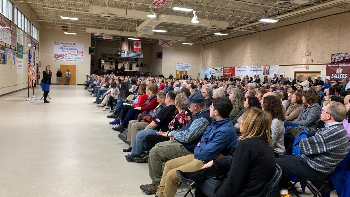 Congresswoman Sherrill answers questions at her town hall meeting Sunday attended by more than 450 constituents.