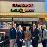 Rep. Sherrill outside of Compare Fresh Market