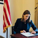 Representative Sherrill reviews information about the Families First Coronavirus Response Act