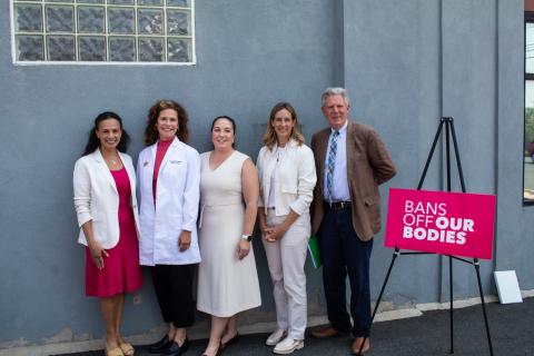 Rep. Sherill posing with Planned Parenthood team members